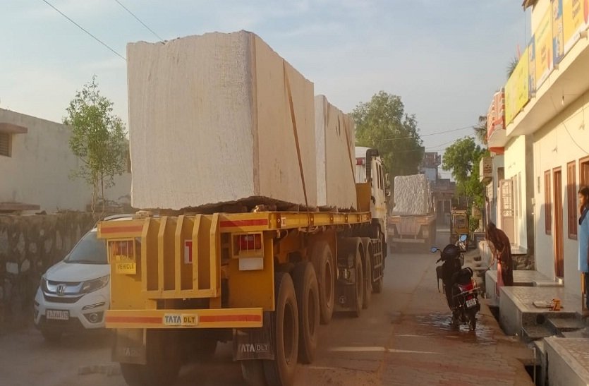 Sirohi/Revdar. Huge stone laden vehicles being taken out of mines without safety arrangements